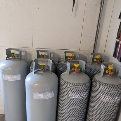 Forklift and commercial propane cylinders filled and ready at Brown's Propane