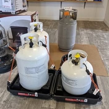 Filled residential propane tanks ready for pickup in the Brown's Propane showroom